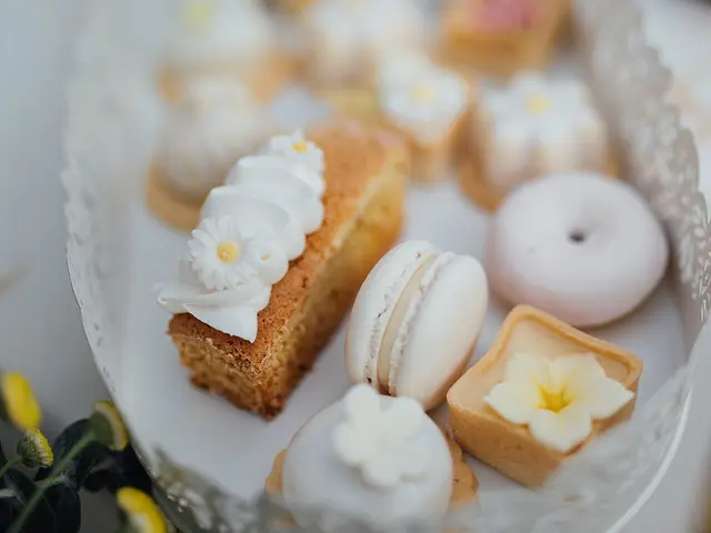 A colourful display of assorted pastries, cakes, and desserts on a tray.