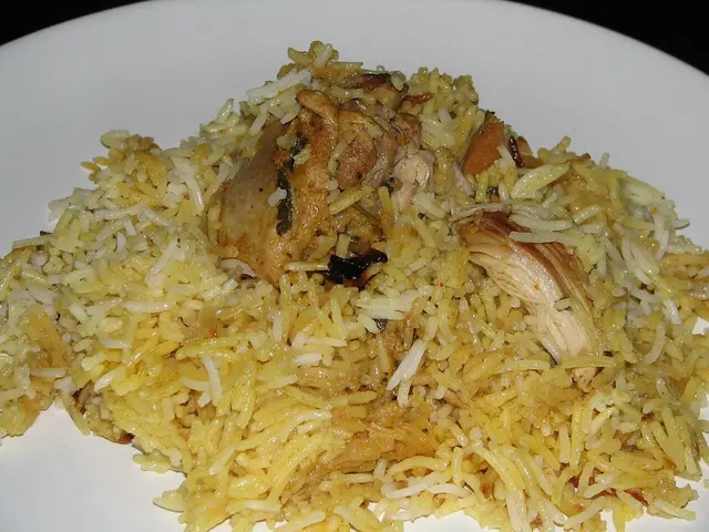 A plated serving of dum biryani, a slow-cooked Indian rice and meat dish.