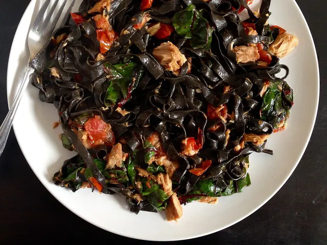 A plate of black squid ink pasta.