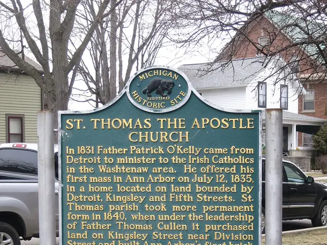 Exterior of Saint Thomas the Apostle Church in Ann Arbor, Michigan, with a Michigan Historic Site marker.