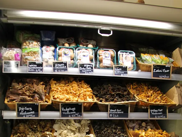 A refrigerated produce case at an Italian marketplace stocked with labeled baskets of mushrooms, artichokes, and sun-dried tomatoes.