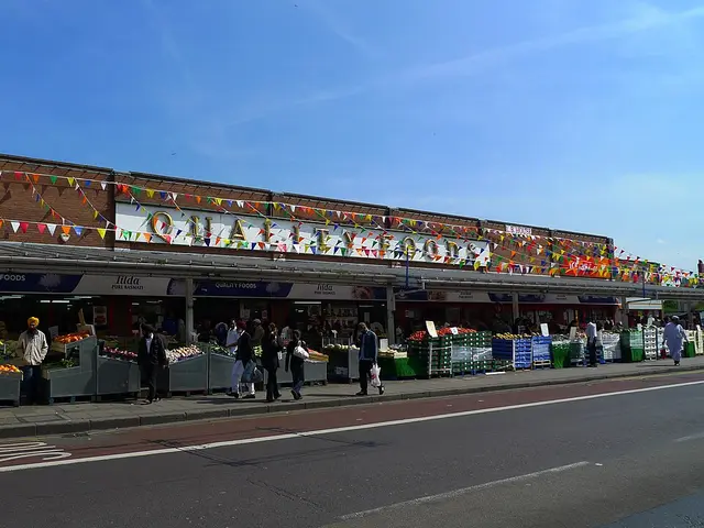 Exterior of Quality Foods, an Indian grocery supermarket with fresh produce displayed outside, in Southall, London.