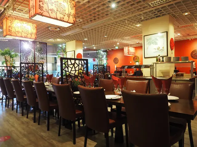 The dining room interior of a Chinese restaurant in a shopping centre.
