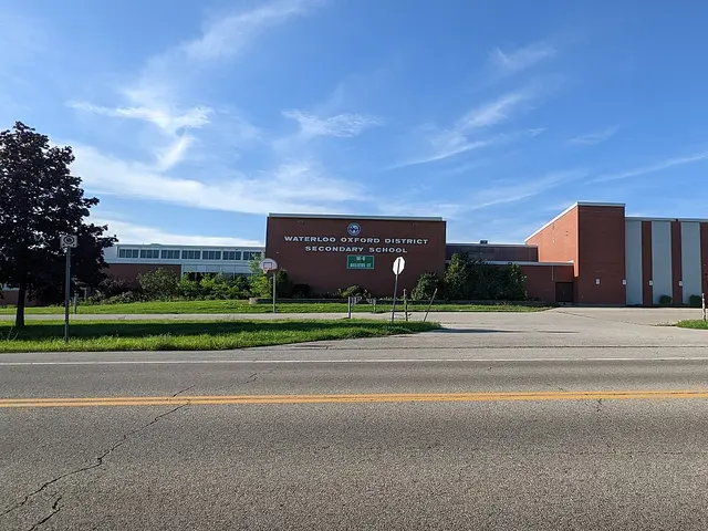 The brick facade of Waterloo Oxford District Secondary School, with the school's name lettered above the entrance.