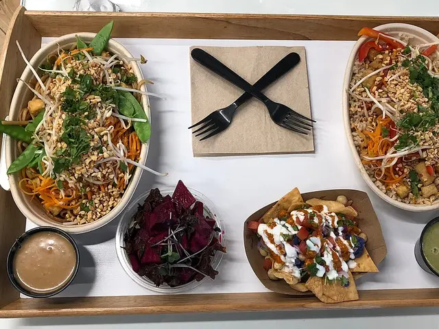A two-person meal at Balance Asian Grille, including bang bang nachos and a curry bowl.