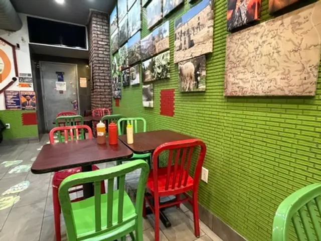The dining area inside a falafel and shawarma restaurant.