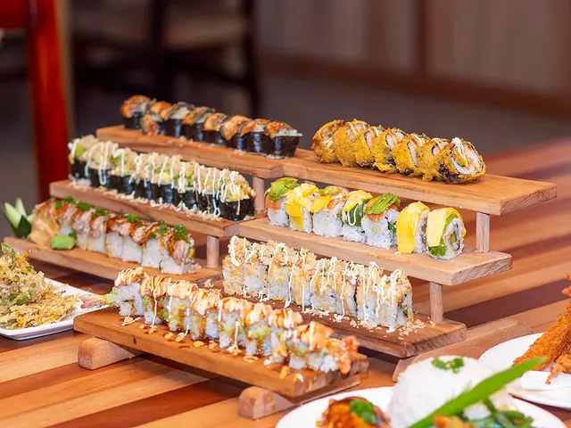 Sushi rolls arranged on a display stand.