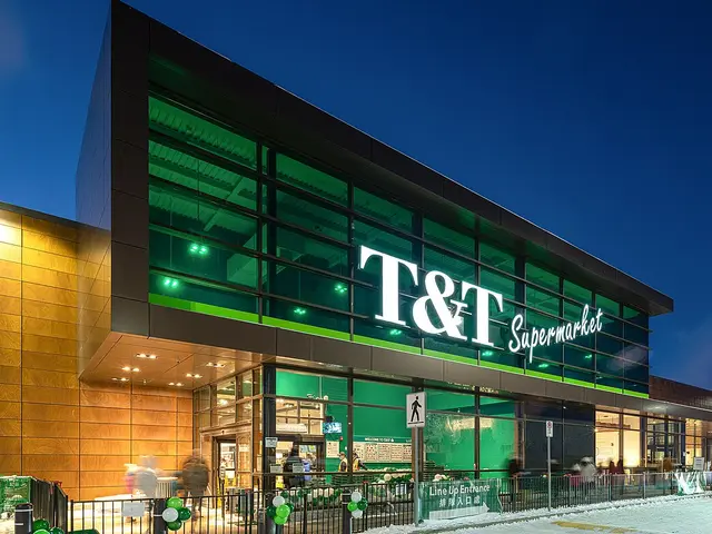 T&T Supermarket storefront lit up at dusk, with green signage over a glass entrance