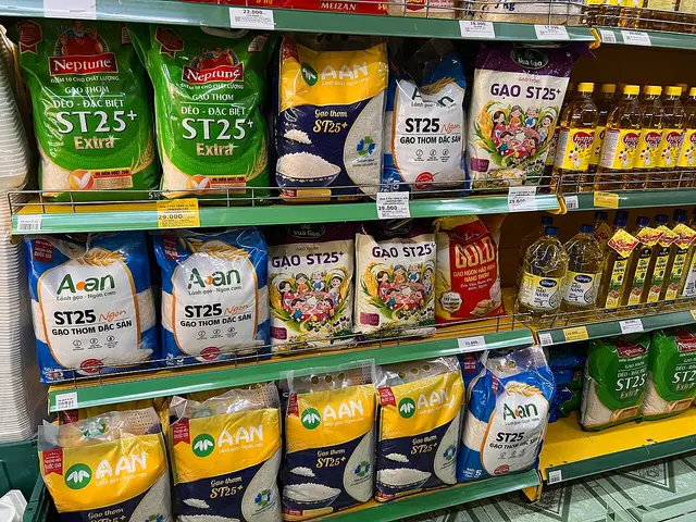 A retail shelf displaying bags of ST25 rice in a Vietnamese grocery store.