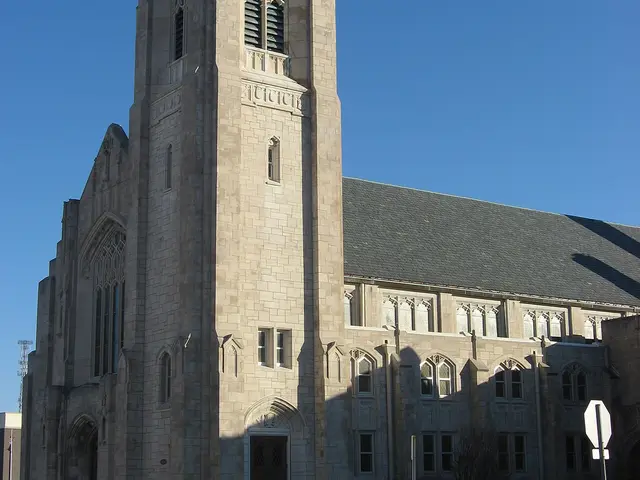 Exterior of First Baptist Church, a brick church building in Muncie, Indiana.