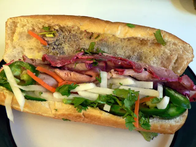 A Vietnamese banh mi sandwich on a plate.