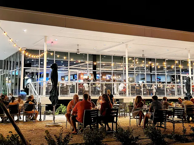 Outdoor restaurant dining area at night.