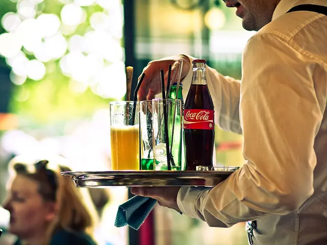 A waiter at work inside a restaurant in Paris.