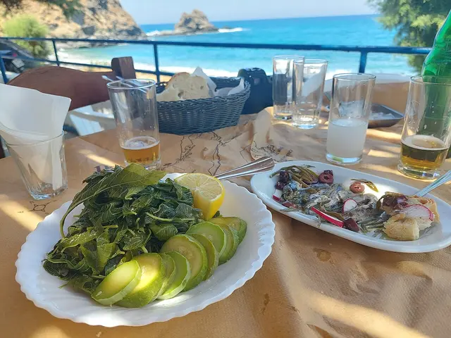 A spread of Mediterranean food served at a restaurant.