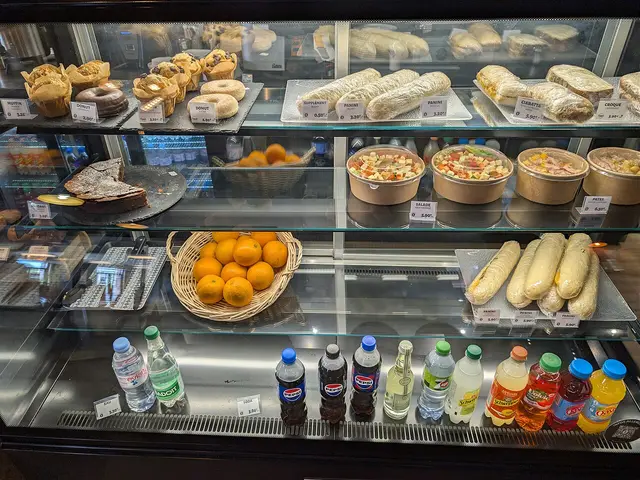 Food display case at the counter of a coffee shop in Dieppe, France.