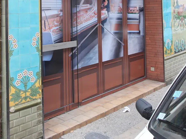 Storefront of a boucherie (butcher shop) called Boucherie Moderne on a street in Pamiers, France.
