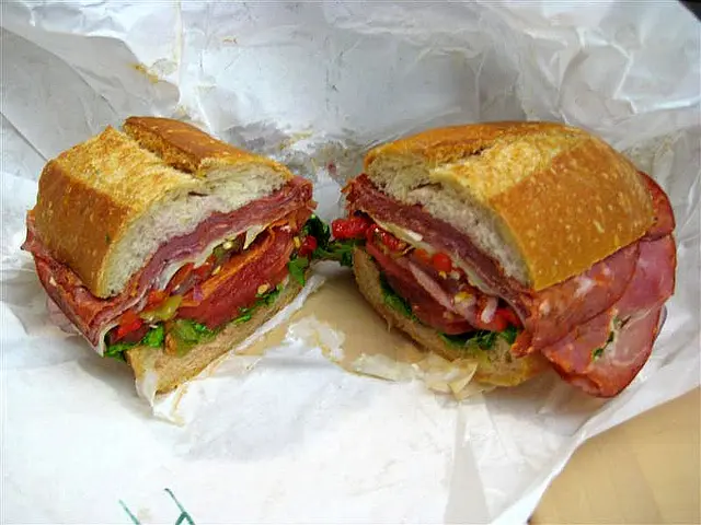 An Italian-style sub sandwich filled with deli meats.
