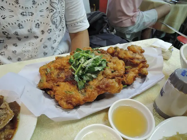 A plate of fried Cantonese oyster dish at a Chinese restaurant.