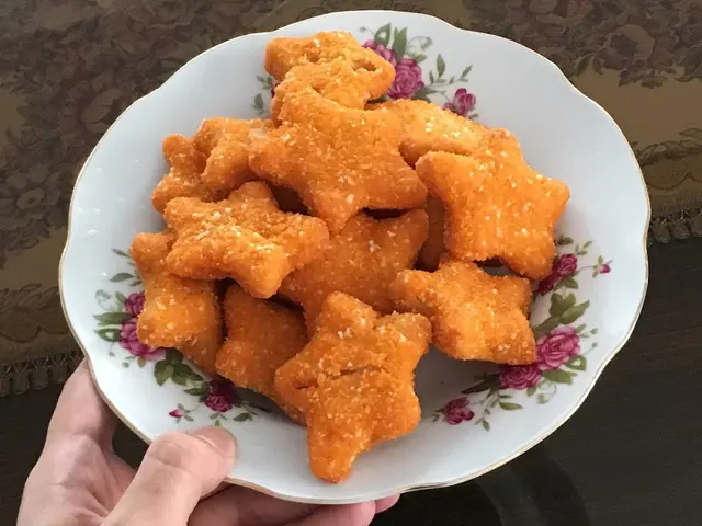 A bowl filled with star-shaped chicken nuggets.