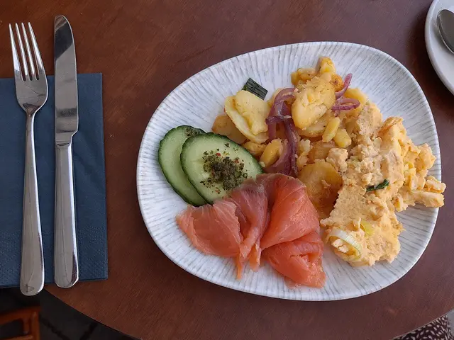 A brunch plate served at a restaurant table.