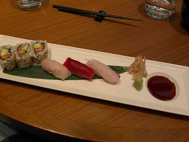 An assorted sushi platter with nigiri, sashimi, and rolls.