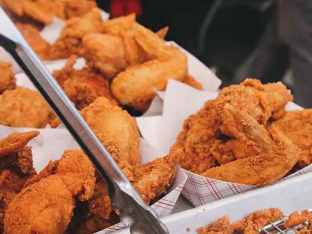 Pieces of fried chicken on a plate.
