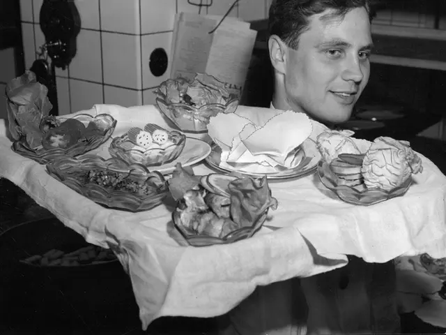 A waiter serving food to a table in a restaurant.