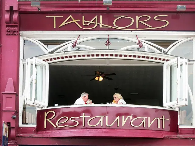 Open-air outdoor dining tables at a restaurant.