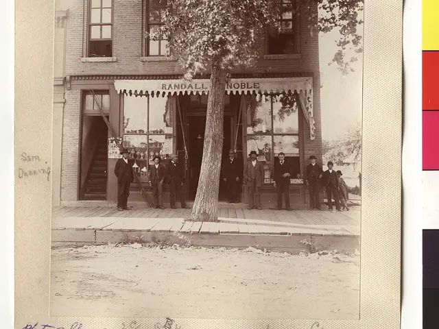 The exterior of a historic small-town grocery store on a street corner.