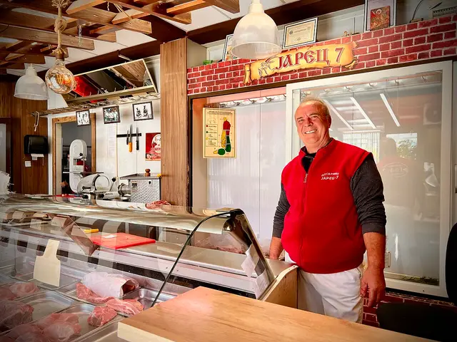 Interior of a butcher shop in Ohrid, North Macedonia, with a meat display counter.