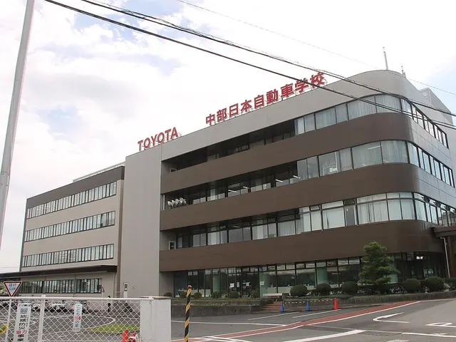 The multi-storey Chubu Nippon Driving School building in Nagoya, Japan, with large rooftop signage.