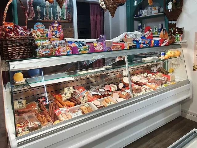 Deli counter display of prepared foods inside Delicatessen Polonus in St Austell, Cornwall.