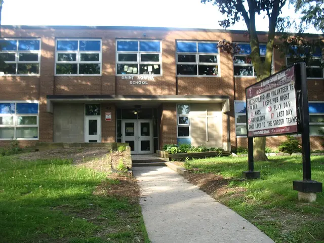 The brick entrance of Saint Agatha Catholic School, with the school's name lettered above the doorway and an events sign out front.