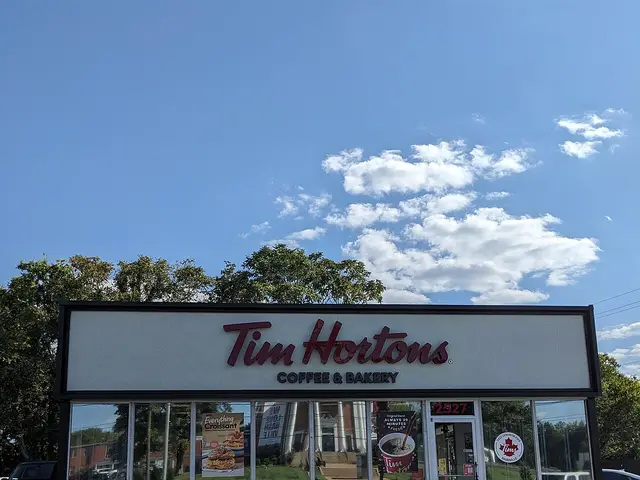 The exterior storefront of a Tim Hortons restaurant.