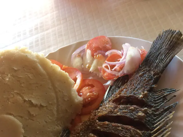 Ugali, a maize-based staple food of East Africa, served with vegetables.