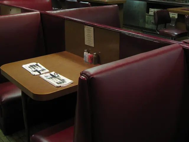 The interior dining room of a steakhouse.