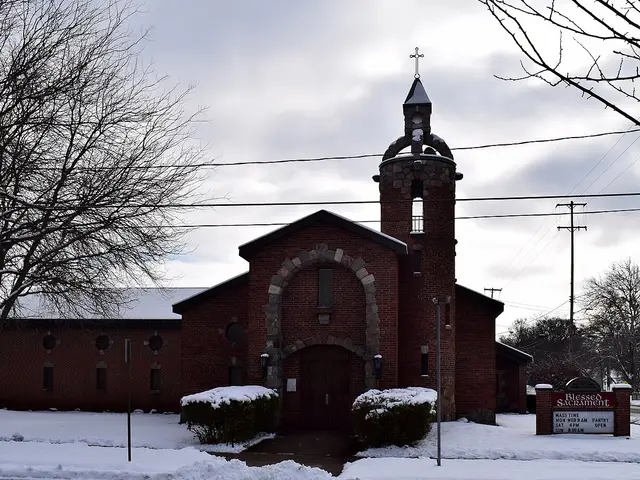 Exterior of Blessed Sacrament Church in Allegan, Michigan, photographed in snow.