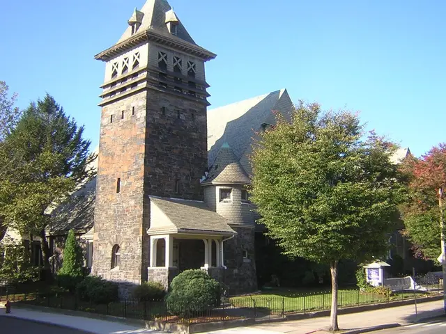 The exterior of a New England congregational church building with a white steeple.