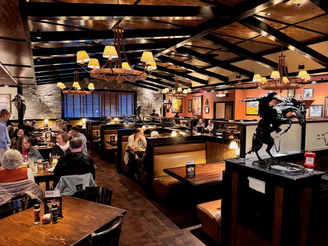 The interior dining room of a steakhouse restaurant.
