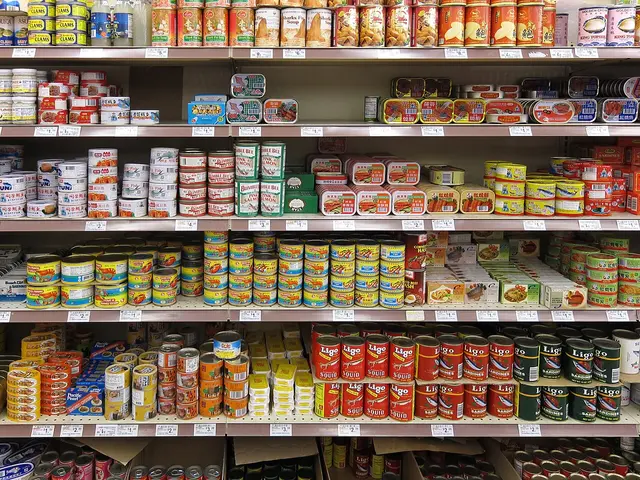 Rows of canned goods with Asian-language labels stocked on grocery store shelves