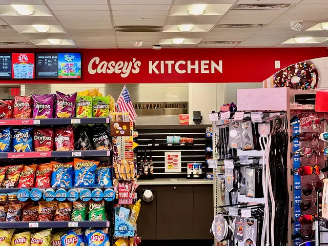 Interior aisle of a Casey's convenience store in Tennessee with shelved snacks and beverages.