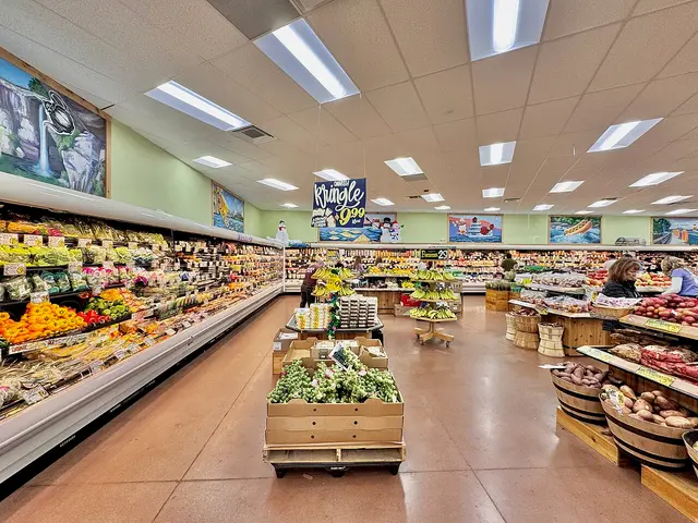 Produce section of a Trader Joe's grocery store with fruit and vegetables on display.