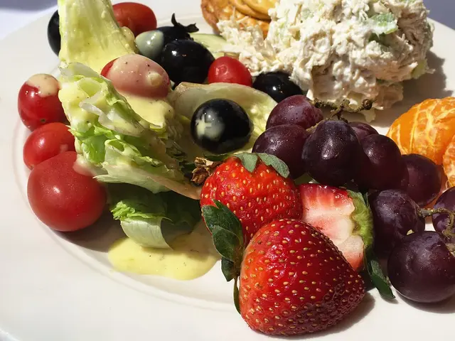 A chicken salad plate served at a restaurant table.