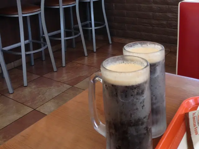 The exterior of an A&W Restaurants location with its root beer branding