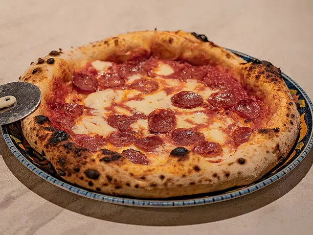 A traditional Neapolitan-style pizza with a charred, puffy crust.