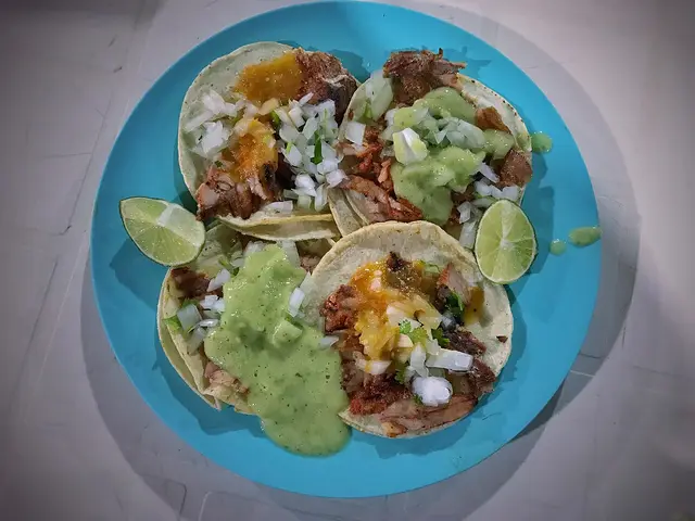 Al pastor tacos served at a Mexican restaurant.
