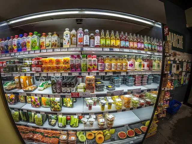 Refrigerated shelving stocked with packaged goods inside a supermarket in Quebec City.