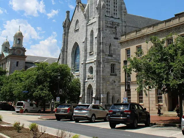 Exterior of Grace United Methodist Church, a stone church building with a tall spire in Harrisburg, Pennsylvania.