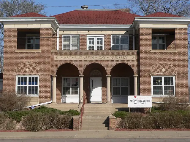 The brick exterior of the Mary Elizabeth Day Nursery and Day Care building, with its name carved above the entrance.