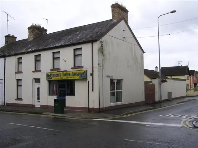 Exterior of a small-town takeaway shop on a street corner.